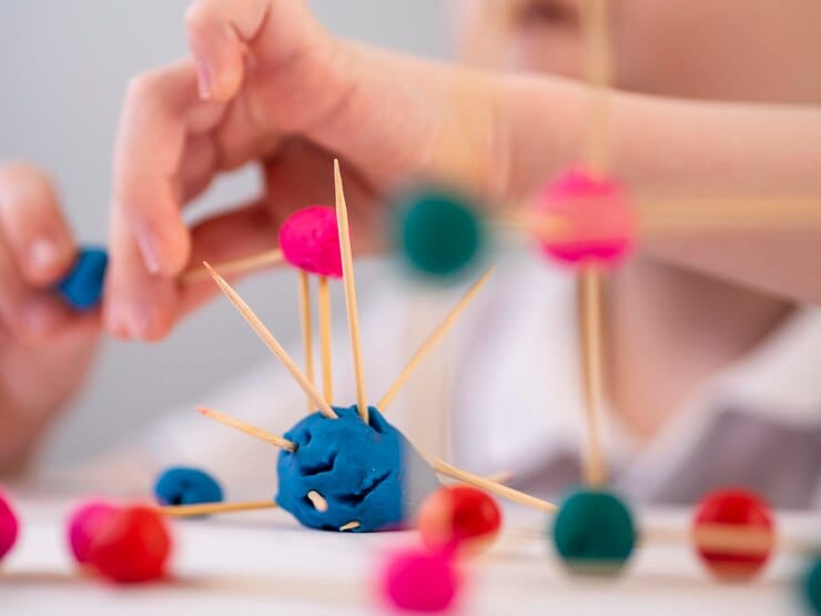 Therapist working with child on fine motor skills